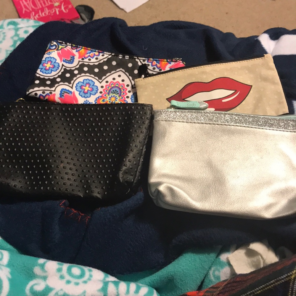 Sold Lot of four make up bags.